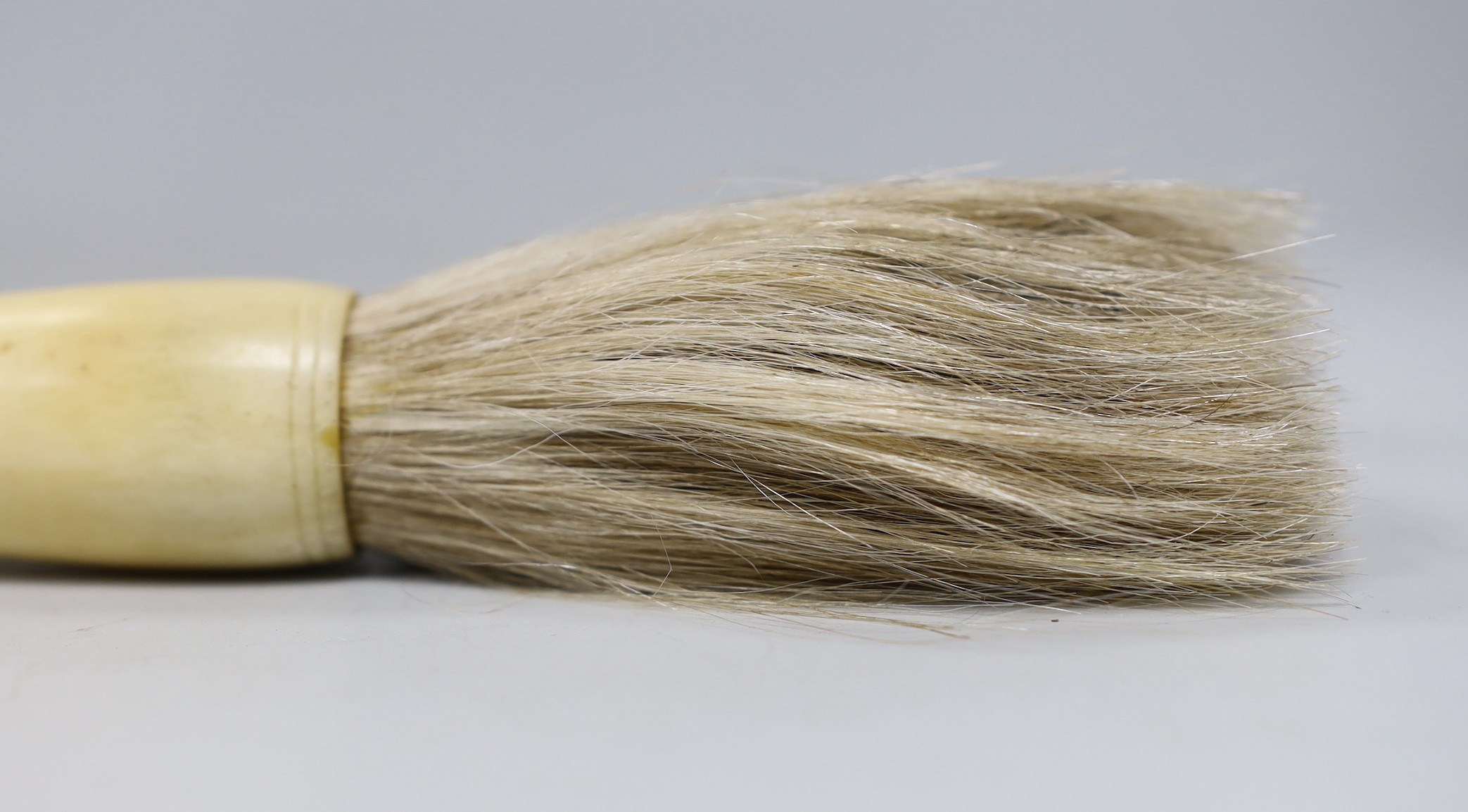 A Chinese bone and bowenite jade mounted calligraphy brush, 35cm lonh, and a bronze brush washer